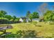 Sprawling backyard featuring a well-kept lawn, landscaping and detached garage at 2175 Highwood Rd, Rock Hill, SC 29732