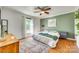 Bright bedroom featuring hardwood floors, an area rug, and a decorative wall accent at 2175 Highwood Rd, Rock Hill, SC 29732