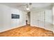Spacious bedroom featuring wood floors, double-door closet, and adjacent room access at 2175 Highwood Rd, Rock Hill, SC 29732