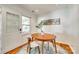 Cozy dining area with an oval wood table, two chairs, and lots of natural light streaming through the windows at 2175 Highwood Rd, Rock Hill, SC 29732