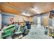 Spacious garage with workbench, lawn tractor, and ample room for storage or projects at 2175 Highwood Rd, Rock Hill, SC 29732