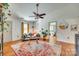 Bright living room with hardwood floors, comfortable seating, and a view into the bedroom through an open doorway at 2175 Highwood Rd, Rock Hill, SC 29732