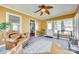 Cozy sunroom with yellow walls, comfortable seating and multiple windows with backyard views at 2175 Highwood Rd, Rock Hill, SC 29732
