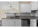 Well-appointed kitchen featuring stainless steel appliances, granite countertops, and white cabinets at 2325 Sanders Ave, Charlotte, NC 28216