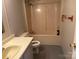 Bathroom showcasing a toilet, vanity, sink, shower-tub combo at 236 Bowmans Cutover Rd, Taylorsville, NC 28681