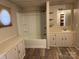 Bathroom featuring linoleum floors, bathtub-shower combo, vanity, and mirror at 236 Bowmans Cutover Rd, Taylorsville, NC 28681