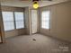 Bedroom with carpet floors, standard closet and natural light from two windows at 236 Bowmans Cutover Rd, Taylorsville, NC 28681