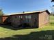 Cozy home with a metal roof, side porch, and a well-maintained yard at 236 Bowmans Cutover Rd, Taylorsville, NC 28681