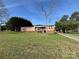 A single story home on a sprawling lawn with mature trees and a blue sky backdrop at 236 Bowmans Cutover Rd, Taylorsville, NC 28681