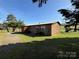 A well-maintained home with a metal roof, a side porch, and a lovely yard at 236 Bowmans Cutover Rd, Taylorsville, NC 28681