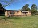 Single story house with porch, offering a blend of cozy living and outdoor charm in a serene, wooded setting at 236 Bowmans Cutover Rd, Taylorsville, NC 28681