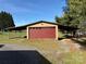 Detached garage with covered parking and a red garage door at 236 Bowmans Cutover Rd, Taylorsville, NC 28681