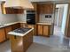 Functional kitchen featuring an island with cooktop and ample cabinet storage at 236 Bowmans Cutover Rd, Taylorsville, NC 28681