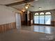 Open living room with wood trim, ceiling fan and natural light at 236 Bowmans Cutover Rd, Taylorsville, NC 28681