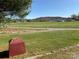 Scenic view of a green field leading to distant hills and farm buildings at 236 Bowmans Cutover Rd, Taylorsville, NC 28681