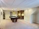 Finished basement with a pool table, bar, carpeted floors and suspended ceilings at 245 Clontz Hill Rd, Troutman, NC 28166