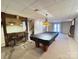 Finished basement features rustic bar area, fireplace, and pool table for entertainment at 245 Clontz Hill Rd, Troutman, NC 28166