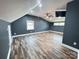 Spacious bonus room features hardwood floors, a ceiling fan, and recessed lighting at 245 Clontz Hill Rd, Troutman, NC 28166
