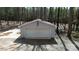 Detached two-car garage featuring an American flag and parking pad at 245 Clontz Hill Rd, Troutman, NC 28166