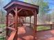 Wooden gazebo with a fan and backyard view at 245 Clontz Hill Rd, Troutman, NC 28166