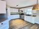 Well-lit kitchen with white cabinets, stainless steel appliances, and ample counter space at 245 Clontz Hill Rd, Troutman, NC 28166