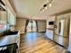 Open concept kitchen with stainless steel appliances, hardwood floors, and access to the deck at 245 Clontz Hill Rd, Troutman, NC 28166