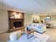 Cozy living room with fireplace and adjacent dining area, great for entertaining and relaxation at 245 Clontz Hill Rd, Troutman, NC 28166
