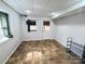 Living room features tile floors, a window, an exit door and an air conditioning unit at 245 Clontz Hill Rd, Troutman, NC 28166