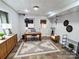 Finished basement office featuring tile floors, ample lighting, desk, and modern decor at 245 Clontz Hill Rd, Troutman, NC 28166