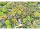 Aerial view showcasing the property's boundaries, surrounded by lush greenery and mature trees in a desirable neighborhood at 2605 Winding Oak Dr, Charlotte, NC 28270