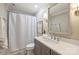 Cozy bathroom with gray vanity, framed mirror, neutral finishes, and tub with shower curtain at 2605 Winding Oak Dr, Charlotte, NC 28270