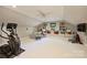 Versatile bonus room featuring a ceiling fan and open space with workout equipment at 2605 Winding Oak Dr, Charlotte, NC 28270
