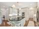 Bright kitchen featuring an island with seating, stainless appliances, and lots of cabinet space at 2605 Winding Oak Dr, Charlotte, NC 28270