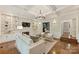 Living room with fireplace, built-ins, coffered ceilings, and hardwood floors at 2605 Winding Oak Dr, Charlotte, NC 28270