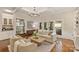 Bright living room with hardwood floors, fireplace, and access to an outdoor patio at 2605 Winding Oak Dr, Charlotte, NC 28270