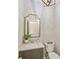Elegant powder room featuring herringbone accent wall, gold mirror, and modern vanity with a vessel sink at 2605 Winding Oak Dr, Charlotte, NC 28270