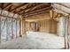 Unfinished bedroom with exposed wood framing and insulation at 2705 Robinson Rd, Newton, NC 28658