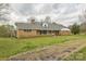 Brick ranch-style home featuring a large yard and a covered front porch, seen from a side angle at 2705 Robinson Rd, Newton, NC 28658