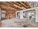 Room with insulation, exposed beams, and a brick wall at 2705 Robinson Rd, Newton, NC 28658