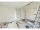 Dilapidated bedroom with damaged door and walls, showing significant repair requirements at 303 E Fisher St, Salisbury, NC 28144