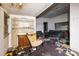 Living room featuring large windows, a decorative fireplace, and a seating area at 303 E Fisher St, Salisbury, NC 28144