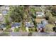 Expansive aerial view showcasing the house, lush landscaping, and surrounding neighborhood at 317 S Lineberry St, Troy, NC 27371