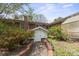 Brick home backyard with a brick walkway between greenery and enclosed entry at 317 S Lineberry St, Troy, NC 27371