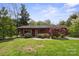 Charming single story home with a cozy front porch and landscaped front yard at 317 S Lineberry St, Troy, NC 27371
