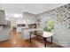 Bright kitchen with white cabinets, an island, and a view of the dining area at 317 S Lineberry St, Troy, NC 27371