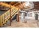 Unfinished basement featuring concrete floor and stairs to the upper level at 3791 Richard St, Claremont, NC 28610