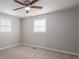 Bedroom with neutral carpet, ceiling fan and two windows for natural light at 3791 Richard St, Claremont, NC 28610