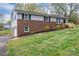 Split-level home with brick facade, new mulch, and a lush front lawn at 3791 Richard St, Claremont, NC 28610