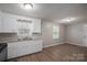 The kitchen features white cabinetry and lots of room at 3791 Richard St, Claremont, NC 28610