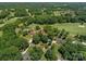 Aerial shot of a neighborhood featuring lush greenery and an arrow indicating the property at 3964 Deer Run Ne Dr, Conover, NC 28613